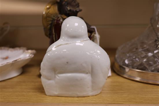 A Shiwan sang-de-boeuf glazed figure of a luohan and an enamelled porcelain figure of a Budai tallest 16cm